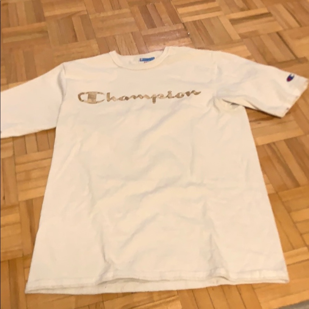 White and gold champion shirt